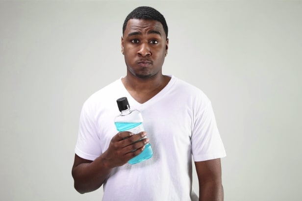 man-frustrated-with-mouthwash